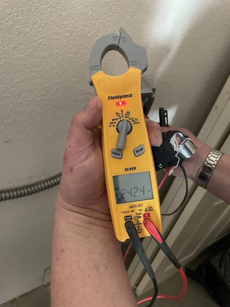 Voltage testing with clamp meter during Generator Installation in Sartell